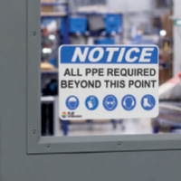 A sign warning of hot surfaces.