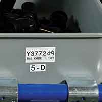 Etichetta multiuso utilizzata su un contenitore di raccolta.